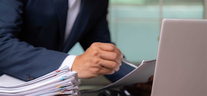 Busy realtor looking at a title commitment