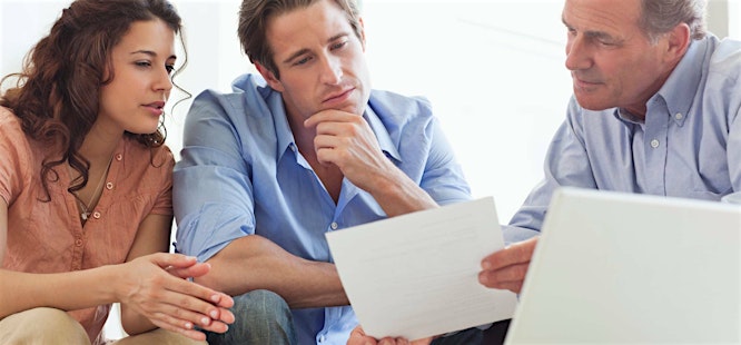 Realtor and clients discussing title insurance