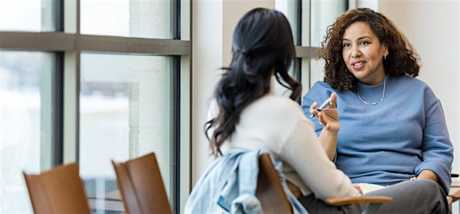 Realtor answering client questions about title ins and closing